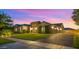 Charming single-story home with manicured lawn and a three-car garage at 17850 E Bronco Ct, Queen Creek, AZ 85142