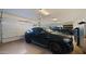Spacious three car garage with vehicles and ample storage providing plenty of space for vehicles and hobbies at 17850 E Bronco Ct, Queen Creek, AZ 85142