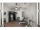 Home gym with exercise equipment, mirrored walls, and natural light at 17850 E Bronco Ct, Queen Creek, AZ 85142