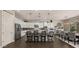 Stylish kitchen features white cabinets, granite countertops, stainless steel appliances, and breakfast bar seating at 17850 E Bronco Ct, Queen Creek, AZ 85142