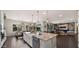 Open kitchen with an island, stainless steel appliances, and a seamless flow to the living areas at 17850 E Bronco Ct, Queen Creek, AZ 85142