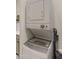 Efficient stacked washer and dryer for space-saving laundry convenience and enhanced home functionality at 17850 E Bronco Ct, Queen Creek, AZ 85142