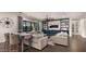 Relaxing living room with stylish seating, fan and custom built-ins for decorative storage and display at 17850 E Bronco Ct, Queen Creek, AZ 85142
