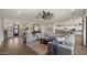 Spacious living room featuring neutral furnishings, tile floors, and seamless access to the open kitchen at 17850 E Bronco Ct, Queen Creek, AZ 85142