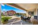 Elegant outdoor living area featuring a well-equipped kitchen, pool, and inviting entertainment space at 17850 E Bronco Ct, Queen Creek, AZ 85142