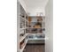 Well-organized walk-in pantry featuring ample shelving, baskets, and storage for food and household items at 17850 E Bronco Ct, Queen Creek, AZ 85142