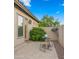 Charming patio with seating area, lush greenery, and a well-maintained outdoor space for relaxation and entertaining at 17850 E Bronco Ct, Queen Creek, AZ 85142