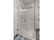 Modern shower with glass enclosure, sleek fixtures, and bright lighting in a contemporary bathroom design at 17850 E Bronco Ct, Queen Creek, AZ 85142