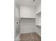 Spacious walk-in closet with ample shelving and rod space, perfect for organized storage and clothing display at 17850 E Bronco Ct, Queen Creek, AZ 85142