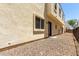 Exterior view of gravel backyard and access to home at 2000 N 36Th St # 19, Phoenix, AZ 85008