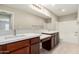 Double sink bathroom is equipped with granite countertops and tile flooring at 2000 N 36Th St # 19, Phoenix, AZ 85008