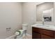 Powder room boasts a modern sink with quartz countertop and decorative accents at 2000 N 36Th St # 19, Phoenix, AZ 85008
