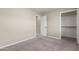 Bedroom with plush carpet and a walk-in closet with shelves at 2000 N 36Th St # 19, Phoenix, AZ 85008