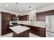 Modern kitchen with stainless steel appliances, pendant lighting, and quartz countertops at 2000 N 36Th St # 19, Phoenix, AZ 85008
