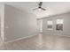 Spacious living room with tile flooring, ceiling fan and bright natural light at 2000 N 36Th St # 19, Phoenix, AZ 85008