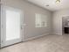 Bright living space with tile floors, neutral walls, and a doorway to the bathroom at 2000 N 36Th St # 19, Phoenix, AZ 85008