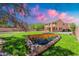 Well manicured backyard with flower beds and trees, perfect for outdoor living at 20277 N 68Th Dr, Glendale, AZ 85308