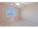Bedroom featuring neutral walls, a ceiling fan, and a window with blinds at 20277 N 68Th Dr, Glendale, AZ 85308