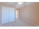 Bedroom with plush carpet, a ceiling fan, and a closet at 20277 N 68Th Dr, Glendale, AZ 85308