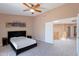 Cozy bedroom with a ceiling fan, closet and neutral carpet flooring at 20277 N 68Th Dr, Glendale, AZ 85308