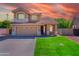 Charming two-story home featuring a well-manicured lawn and an attached two-car garage at 20277 N 68Th Dr, Glendale, AZ 85308