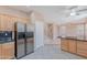 Open concept kitchen featuring stainless steel appliances, granite countertops, and tile flooring at 20277 N 68Th Dr, Glendale, AZ 85308