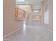 Open-concept living room featuring a high ceiling, tile floors, and an open staircase at 20277 N 68Th Dr, Glendale, AZ 85308