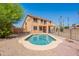 Backyard with a sparkling pool, landscaping, and stunning two-story home at 20277 N 68Th Dr, Glendale, AZ 85308
