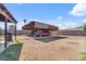 Large, open backyard with covered parking and ample space for storage and outdoor activities at 2319 N 71St Dr, Phoenix, AZ 85035