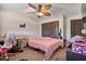 Cozy bedroom with tile floors, ceiling fan, and closet at 2319 N 71St Dr, Phoenix, AZ 85035