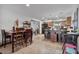 Open floor plan with a cozy dining table connecting the kitchen and living room spaces at 2319 N 71St Dr, Phoenix, AZ 85035