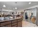 Open concept kitchen with tile floors and view to living area at 2319 N 71St Dr, Phoenix, AZ 85035