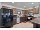 Kitchen with stainless steel dishwasher, ample counter space, and lots of storage at 2319 N 71St Dr, Phoenix, AZ 85035