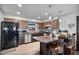 Well-equipped kitchen with island seating, modern appliances, and efficient layout at 2319 N 71St Dr, Phoenix, AZ 85035