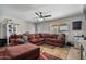 Living room boasting a large sectional sofa, accent rug, and ample natural light at 2319 N 71St Dr, Phoenix, AZ 85035