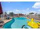A refreshing pool area features a slide and fun floaties, perfect for summer days at 2319 N 71St Dr, Phoenix, AZ 85035