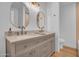 Bathroom features dual sinks with neutral cabinets and a modern aesthetic at 2712 N 20Th Dr, Phoenix, AZ 85009