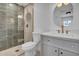 Updated bathroom with tiled shower, modern vanity, and elegant fixtures at 2712 N 20Th Dr, Phoenix, AZ 85009