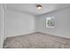 Bedroom featuring carpet floors, window, and a modern ceiling light at 2712 N 20Th Dr, Phoenix, AZ 85009