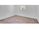 Bright bedroom features neutral paint, plush carpet, and natural light from window at 2712 N 20Th Dr, Phoenix, AZ 85009