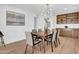 Bright dining room features a modern light fixture, stylish decor, and built-in shelves for storage at 2712 N 20Th Dr, Phoenix, AZ 85009