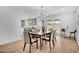 Bright dining room with a modern chandelier, a dining table set, and backyard access at 2712 N 20Th Dr, Phoenix, AZ 85009