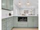 Open kitchen view with custom cabinets, modern microwave and white quartz countertops at 2712 N 20Th Dr, Phoenix, AZ 85009