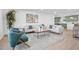 Stylish living room featuring comfortable seating, a modern rug, and an open floor plan at 2712 N 20Th Dr, Phoenix, AZ 85009