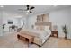 Spacious main bedroom with a ceiling fan, wood-look floors, and plenty of natural light at 2712 N 20Th Dr, Phoenix, AZ 85009