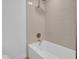 Bathroom features a soaking tub with white tile and gold-colored fixtures at 2712 N 20Th Dr, Phoenix, AZ 85009