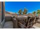 Backyard featuring an outdoor kitchen, seating area, lush trees, and a blue sky at 3016 W White Canyon Rd, San Tan Valley, AZ 85144