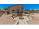 An inviting backyard with a fire pit, seating, and dining area, great for entertaining and outdoor living at 3016 W White Canyon Rd, San Tan Valley, AZ 85144