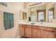 Bathroom featuring a double vanity, a large mirror, and well-lit space at 3016 W White Canyon Rd, San Tan Valley, AZ 85144