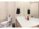 Half bathroom featuring a white vanity with a sink and toilet at 3016 W White Canyon Rd, San Tan Valley, AZ 85144